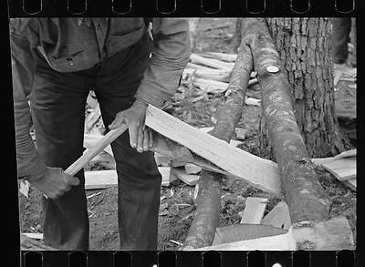 Splitting shingles with froe,maul on Wilson Cedar Forest,near Lebanon 