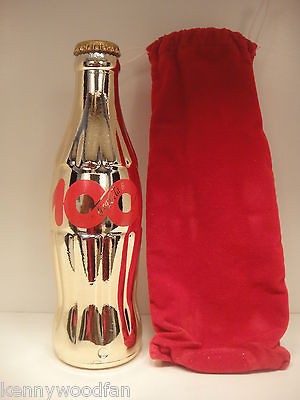 gold coca cola bottle in Bottles