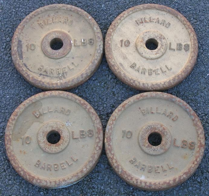 Four vintage Billard 10 pound weight plates. Good condition, though 