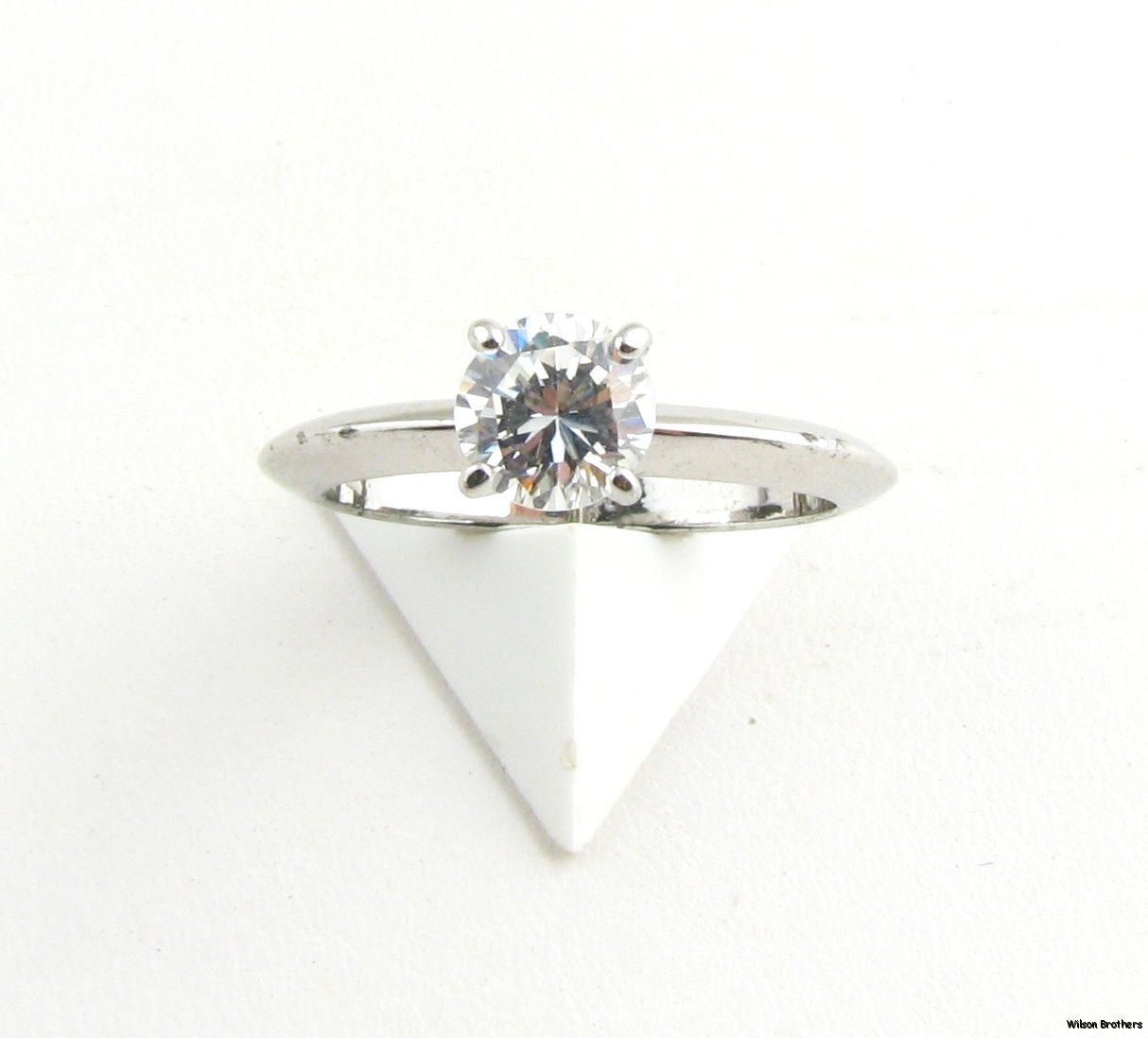 pretty ring is done in an engagement style set with a 6mm round cut CZ