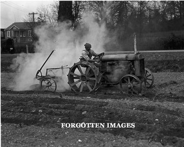 Farmer Tilling Field with Tractor 1920s Photograph