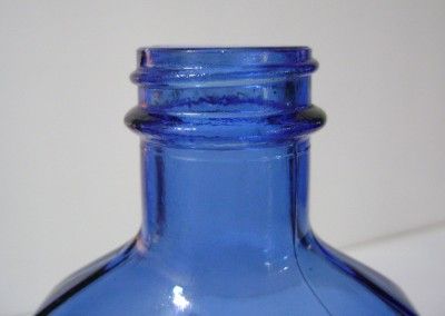 Medicine Bottle Cobalt Blue Embossed Milk of Magnesia