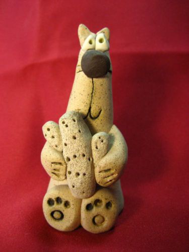 Arizona Clay Figurine Coyote? Holding Saguaro Cactus