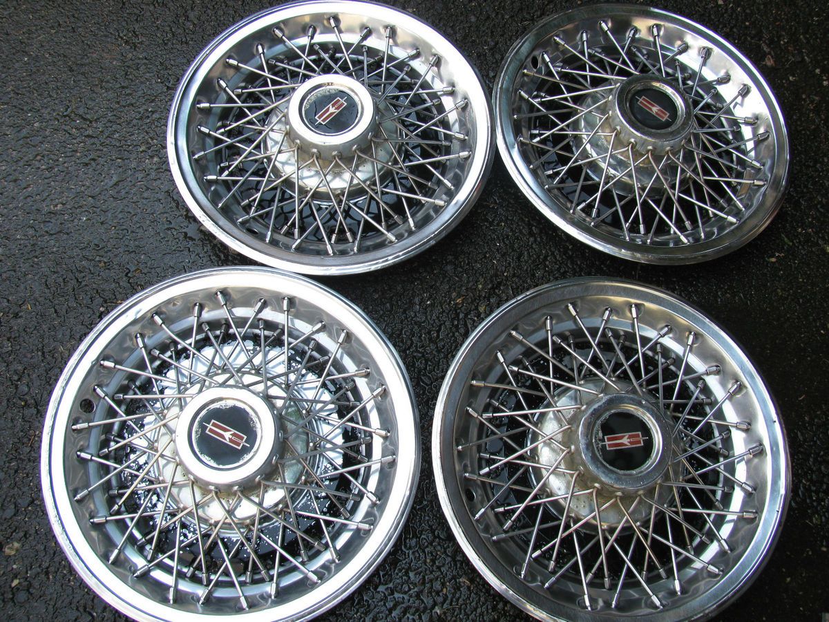 VINTAGE ORIGINAL EQUIPMENT WIRE RIM WHEEL COVERS 15 INCH OLDSMOBILE